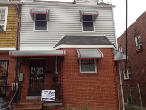 Aluminum canopies installed over windows and door